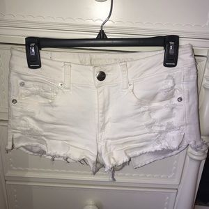 White distressed AEO shorties